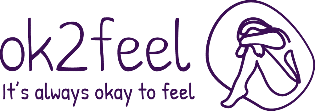 OK2Feel logo with cozy figure hugging knees, embracing emotions. Encouraging message: It's always okay to feel.