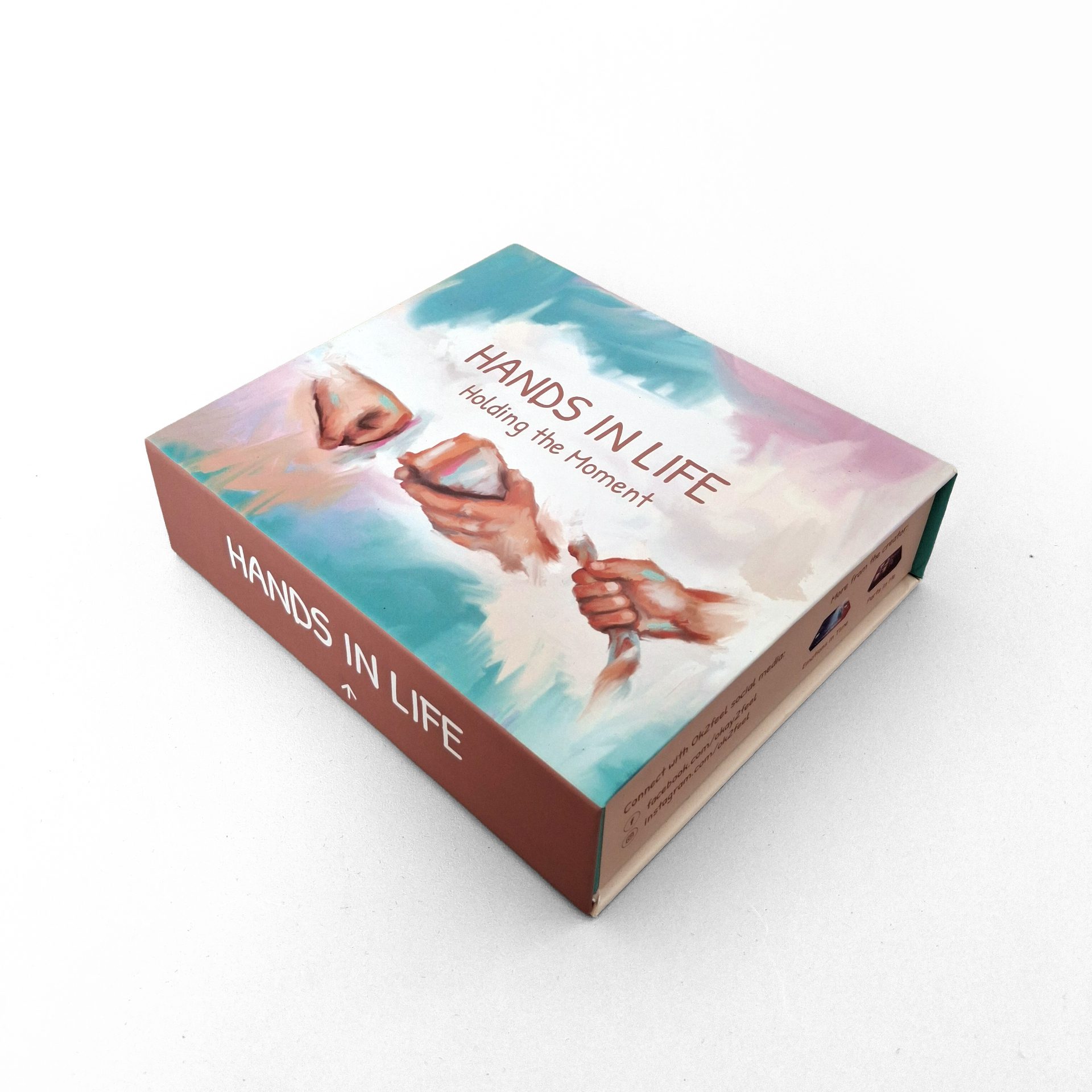 Hands In Life box showing hands holding items, symbolizing connection and emotional support through creative healing.